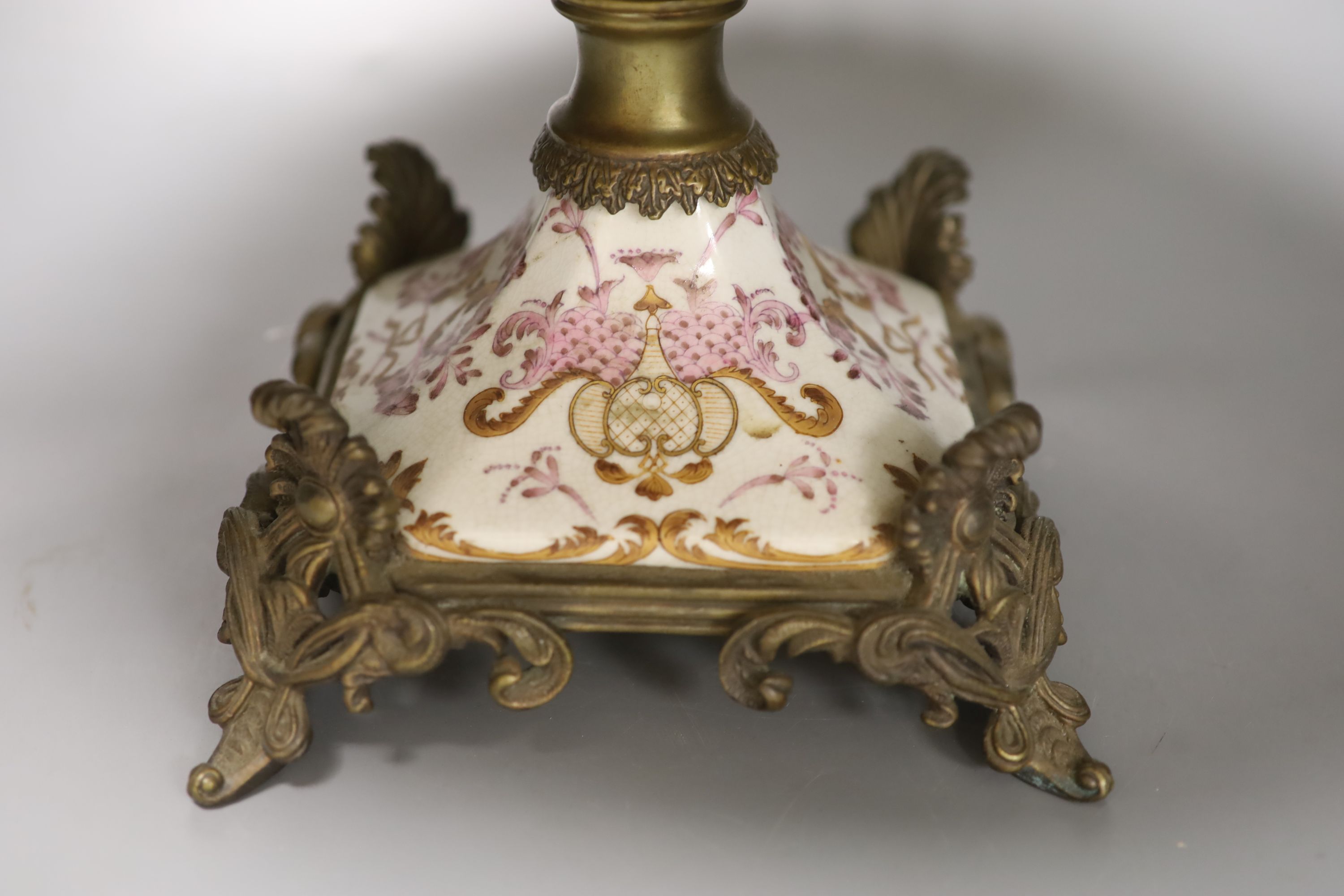 A Continental gilt metal mounted porcelain tazza, diameter 42.5cm height 24cm